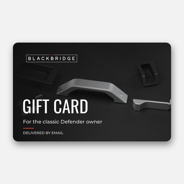 Blackbridge Motors gift card over a rendering of Defender interior door hardware
