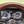 Wood-rim steering wheel in front of the AutoMeter InVision LCD gauge cluster